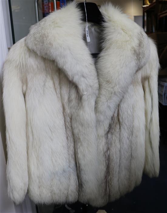 A white fur fox jacket